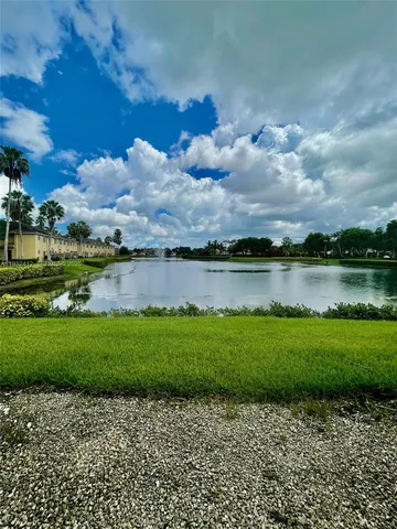 a view of a lake with a big yard