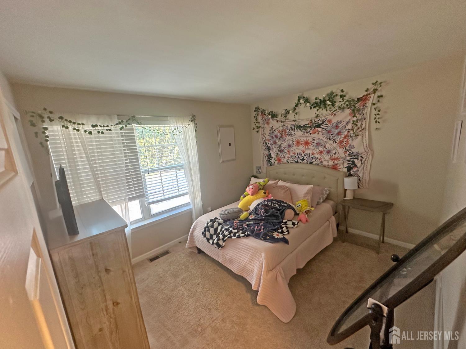 266 Dochery Place Somerset, NJ 08873 - Photo 14 of 20 a bedroom with furniture and a large window