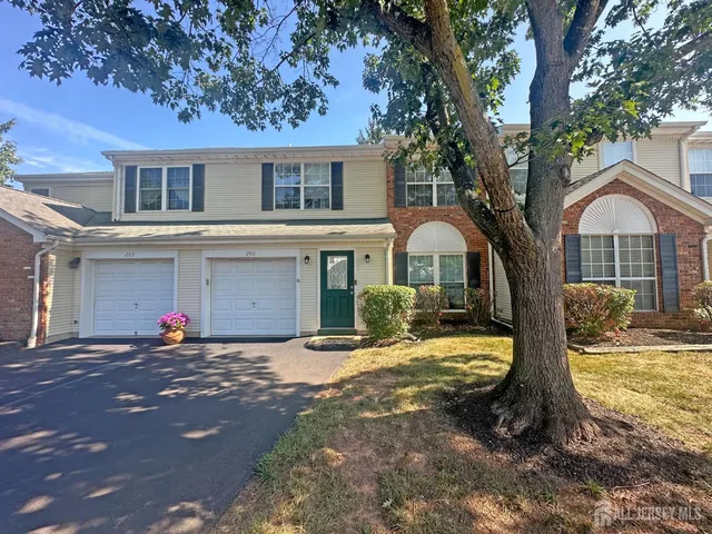 a view of a yard with a tree