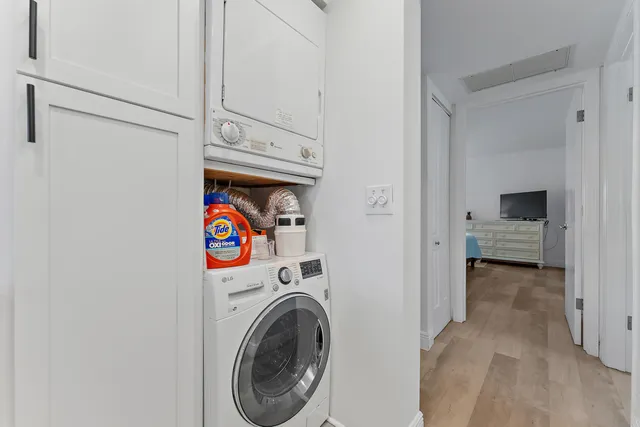 a view of a storage & utility room with dryer and washer