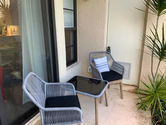 a view of a hallway with seating area