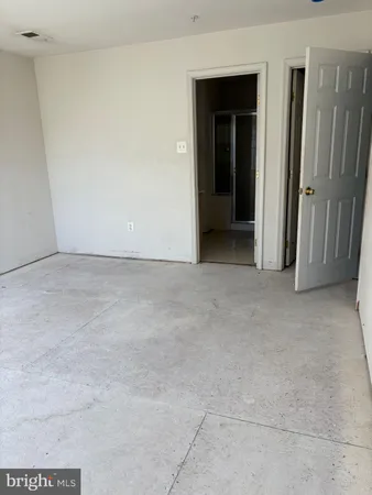 a view of an empty room with a hallway