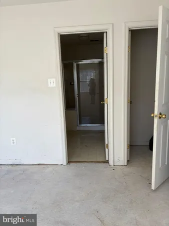 a bathroom with a glass shower door