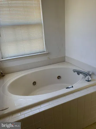 a room with a sink and a mirror