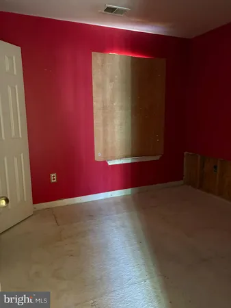 a bathroom with a toilet and a bathtub