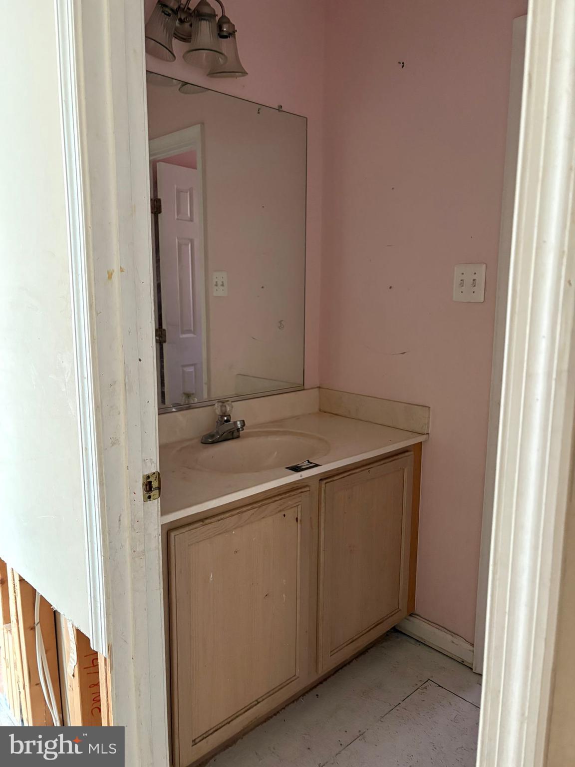 9310 Biemans Terrace Bowie, MD 20721 - Photo 34 of 40 a bathroom with a sink and a mirror