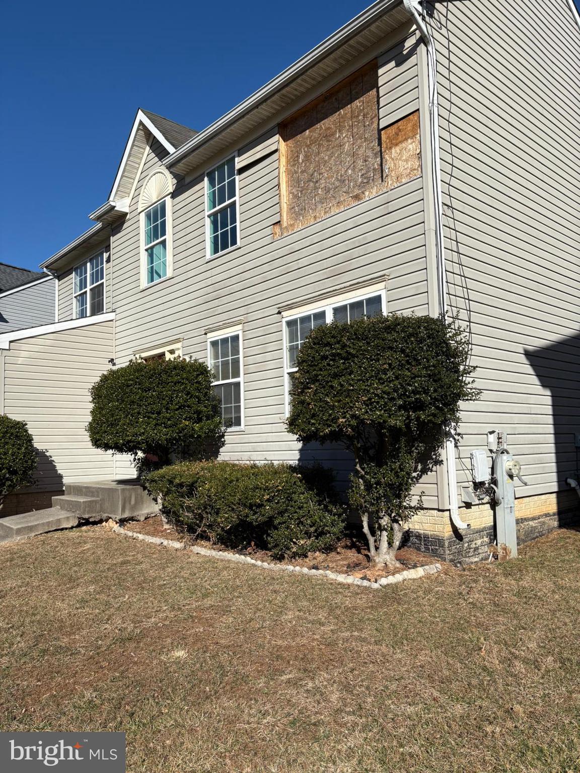 9310 Biemans Terrace Bowie, MD 20721 - Photo 5 of 40 a backyard of a house with outdoor seating