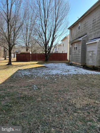 a view of the house with a yard