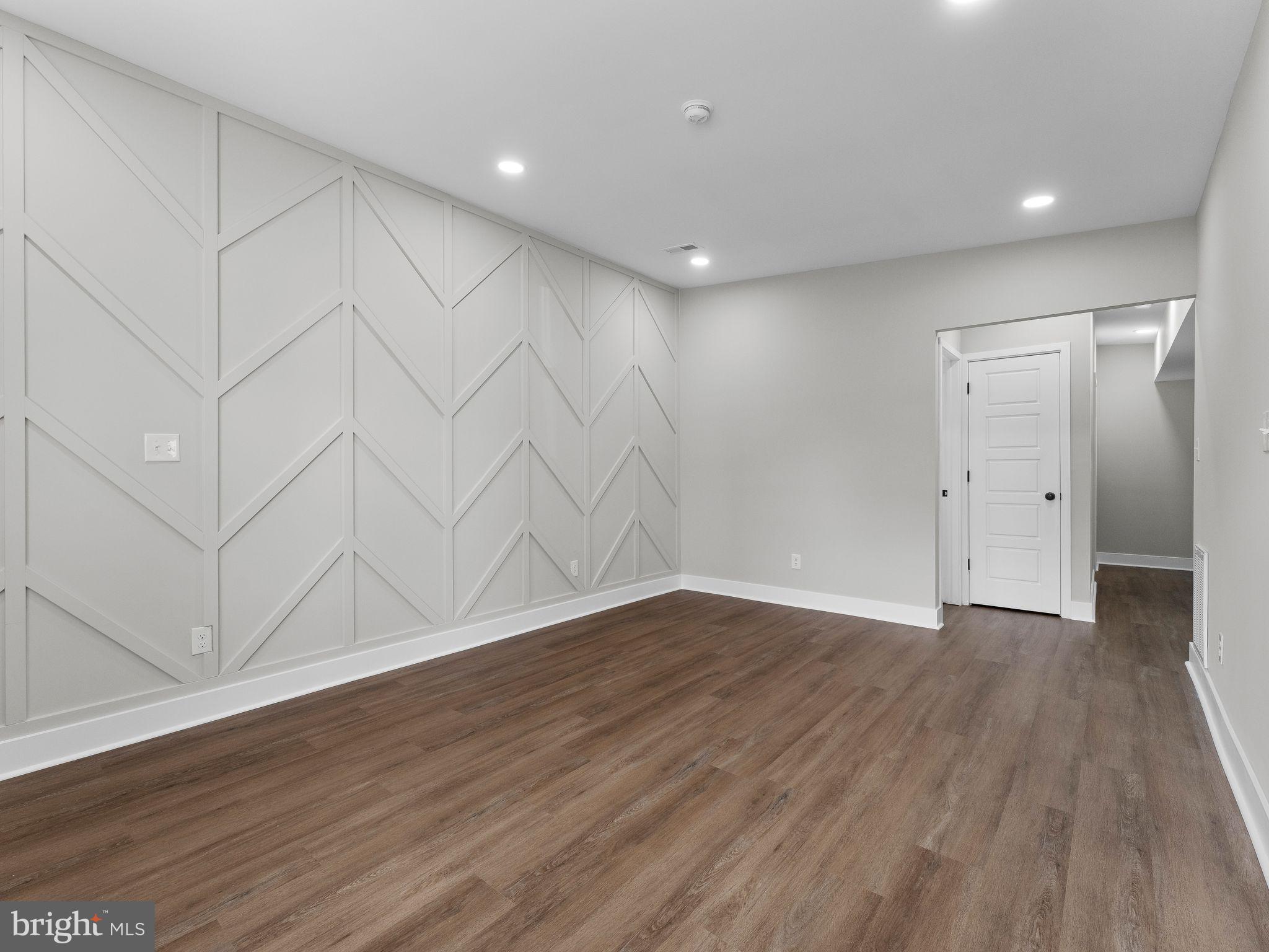 9314 Trout Road Philadelphia, PA 19115 - Photo 6 of 23 a view of an empty room with wooden floor