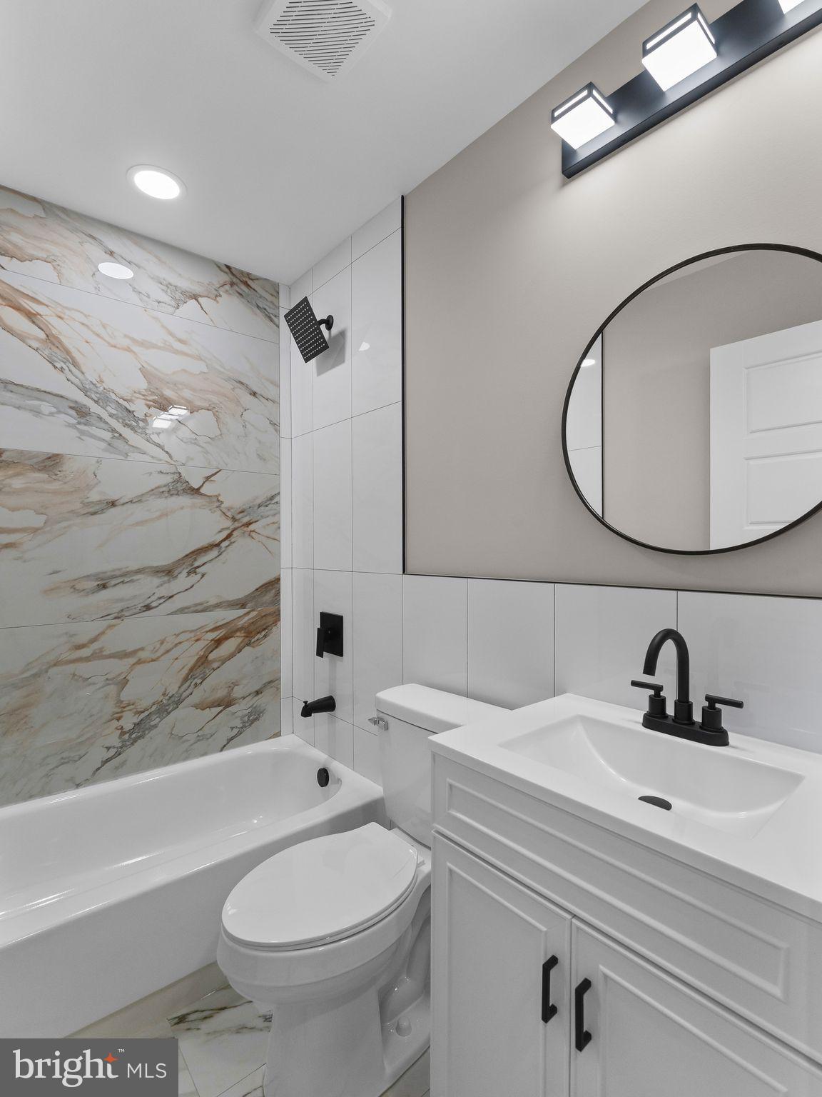 9314 Trout Road Philadelphia, PA 19115 - Photo 9 of 23 a bathroom with a sink a toilet and shower
