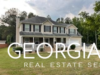 95 Browning Drive Covington, GA 30016 - Photo 1 of 1 a backyard of a house with garden and entertaining space
