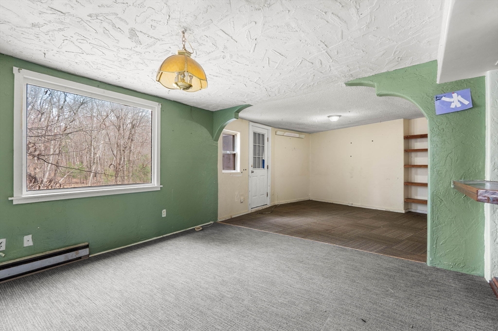 47 Riverside Drive North Reading, MA 01864 - Photo 22 of 34 a view of an empty room with window and flowerpot