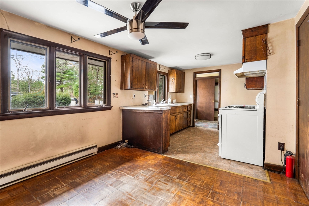 47 Riverside Drive North Reading, MA 01864 - Photo 4 of 34 a view of a kitchen with microwave and windows