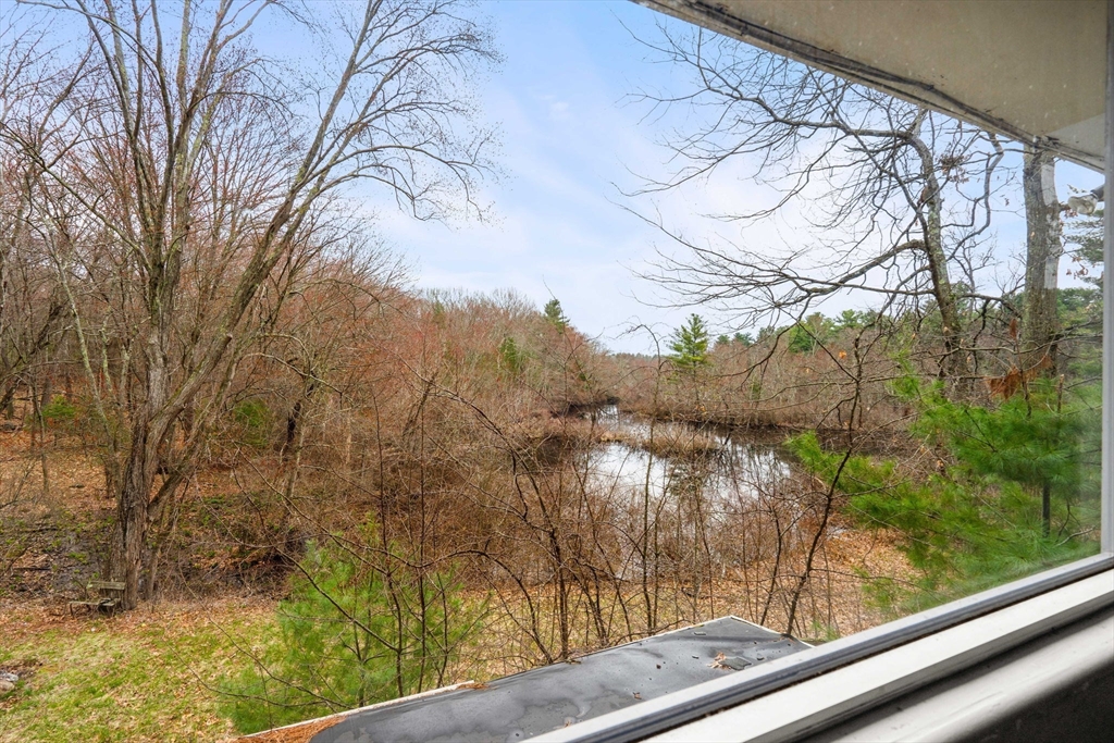 47 Riverside Drive North Reading, MA 01864 - Photo 7 of 34 a view of a yard from a window