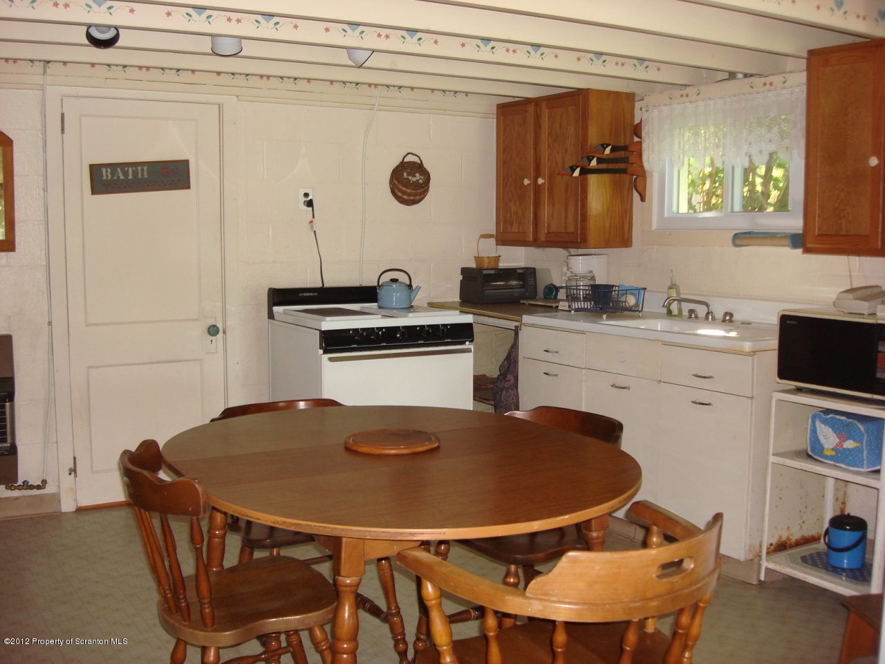 26 1/2 Indian Spring Road Tunkhannock, PA 18657 - Photo 3 of 11 a kitchen with a dining table and chairs