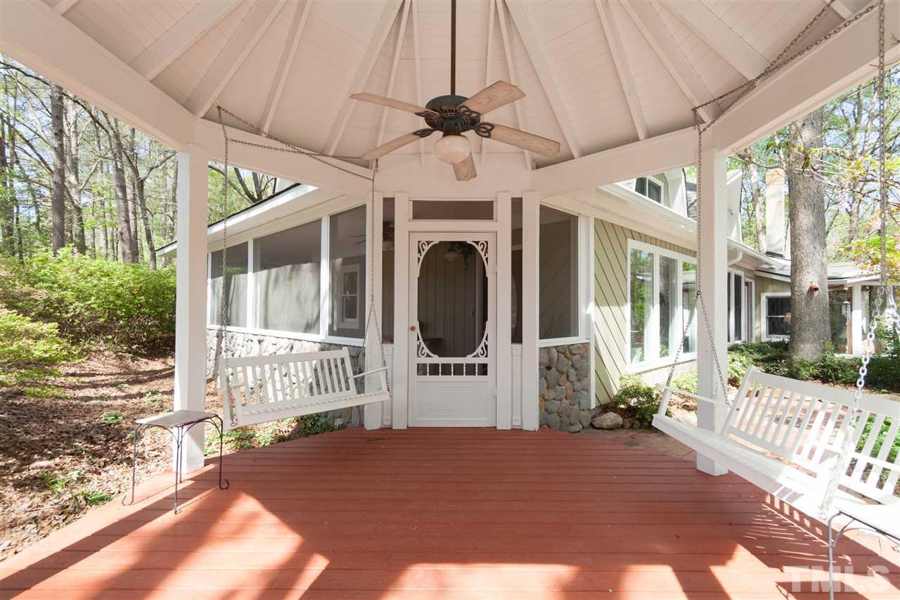 7016 Farmdale Road Raleigh, NC 27610 - Photo 3 of 25 a front view of a house with wooden floor and a large window