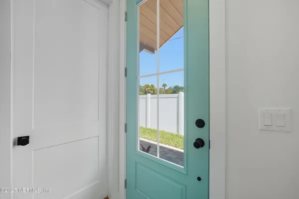 a kitchen with a sink and a chandelier