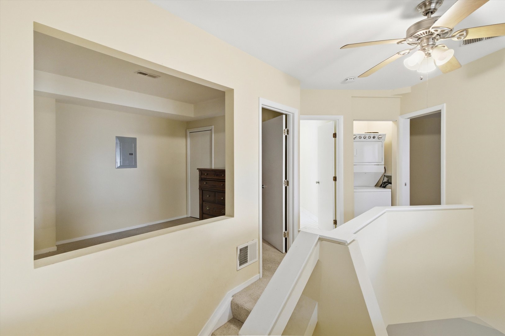 6337 Roosevelt Road, Unit 114 Berwyn, IL 60402 - Photo 19 of 33 a spacious bedroom with a bed and a chandelier