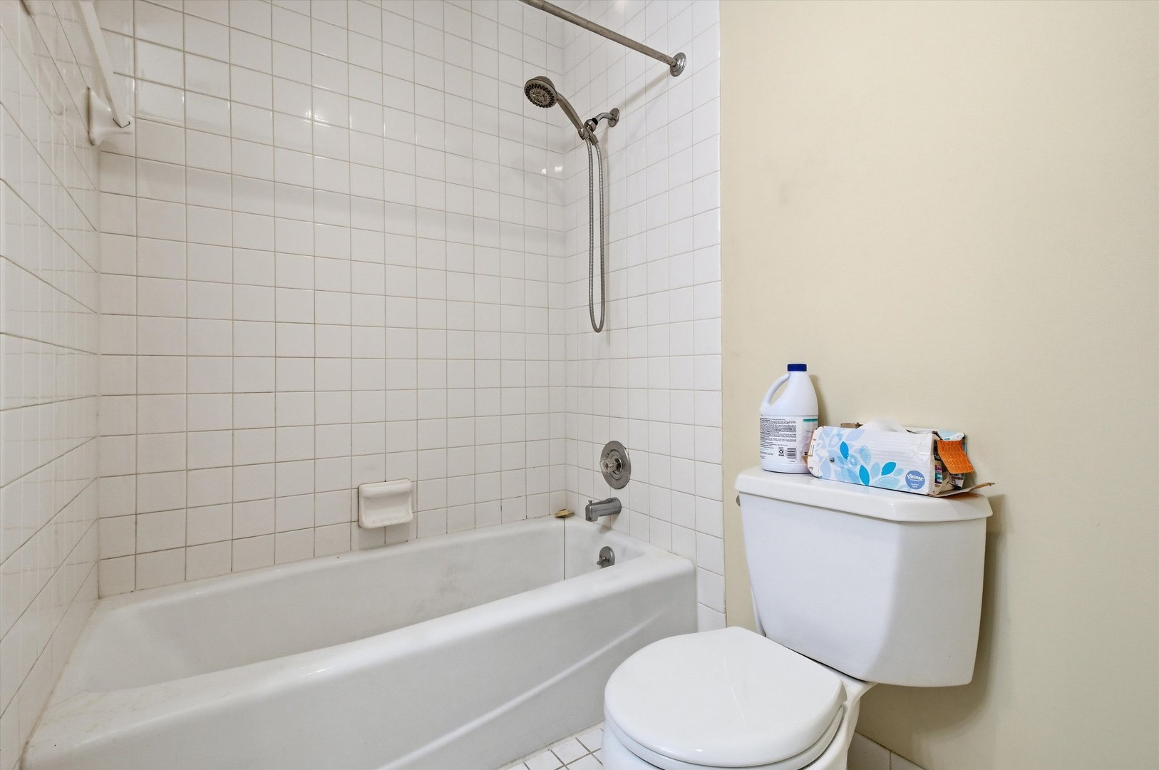 6337 Roosevelt Road, Unit 114 Berwyn, IL 60402 - Photo 10 of 33 a white toilet sitting next to a bath tub
