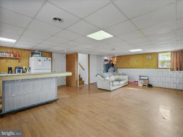 a view of a room with furniture and window