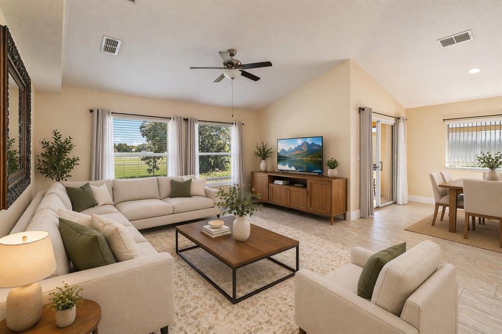 2327 Andrews Valley Drive Kissimmee, FL 34758 - Photo 11 of 42 a living room with furniture and a large window