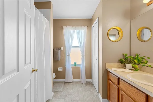 a bedroom with furniture and a window