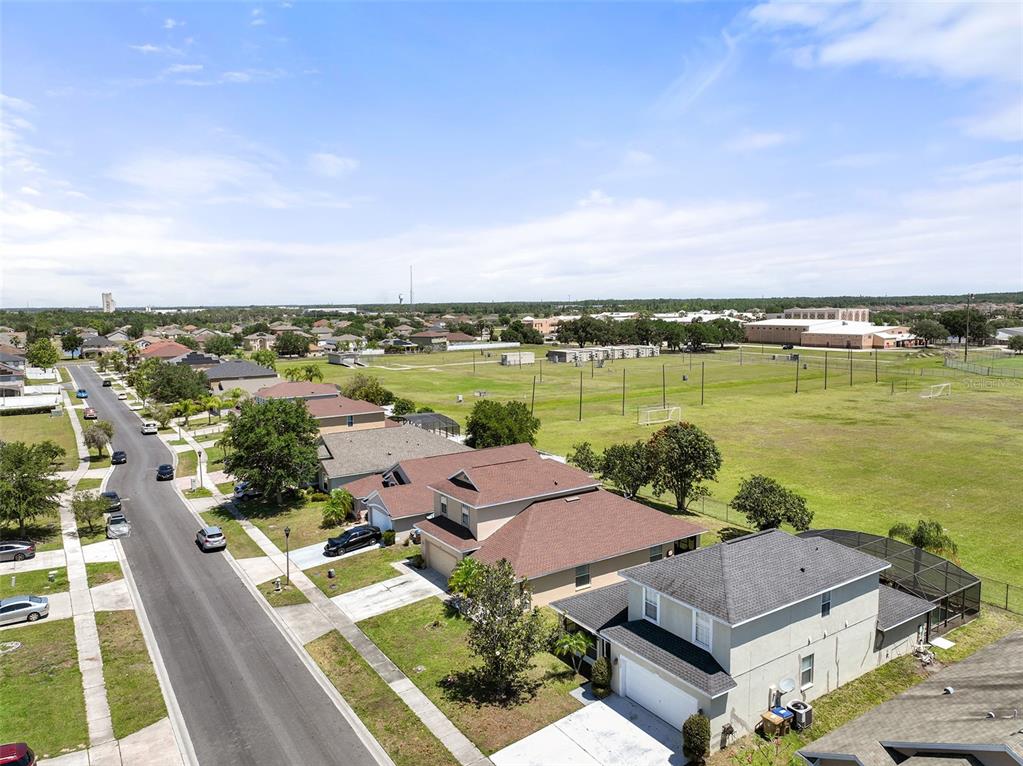 2327 Andrews Valley Drive Kissimmee, FL 34758 - Photo 38 of 42 an aerial view of a house with outdoor space and lake view in back