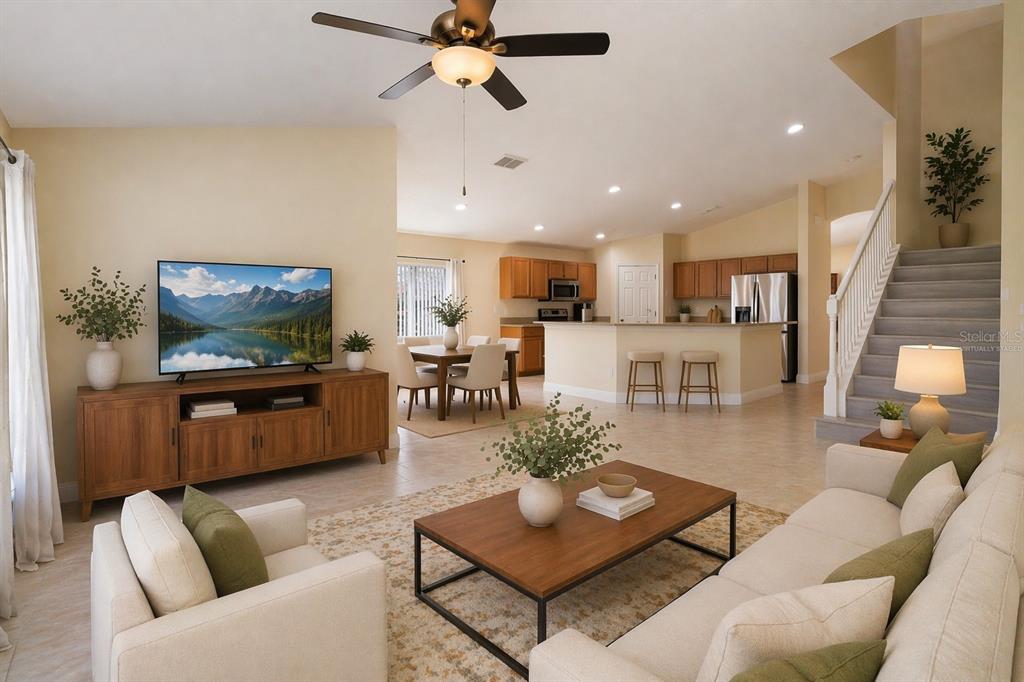 2327 Andrews Valley Drive Kissimmee, FL 34758 - Photo 10 of 42 a living room with furniture kitchen view and a flat screen tv