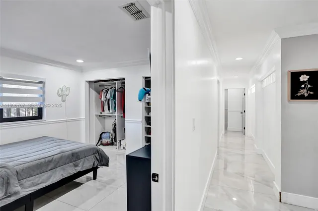 a bedroom with a bed and a view of bathroom