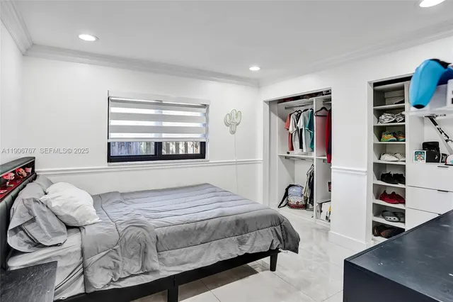 a bedroom with a bed and closet