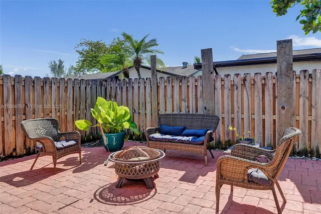 a outdoor living space with furniture and a potted plant