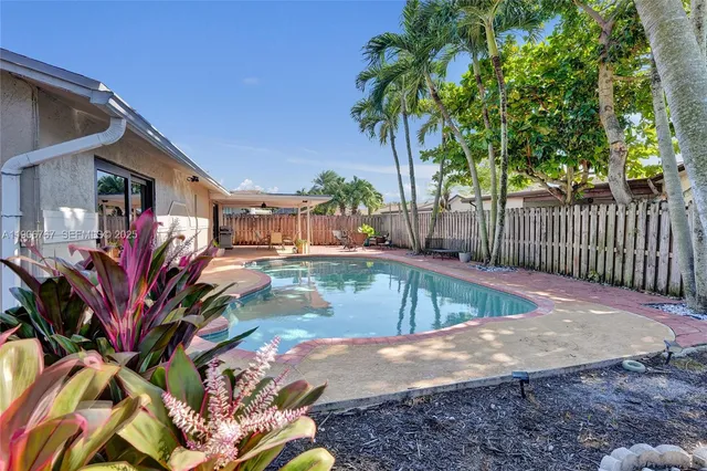 a view of a swimming pool with a patio