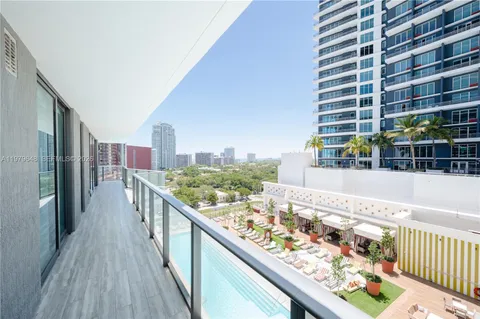 a view of balcony with wooden floor and fence