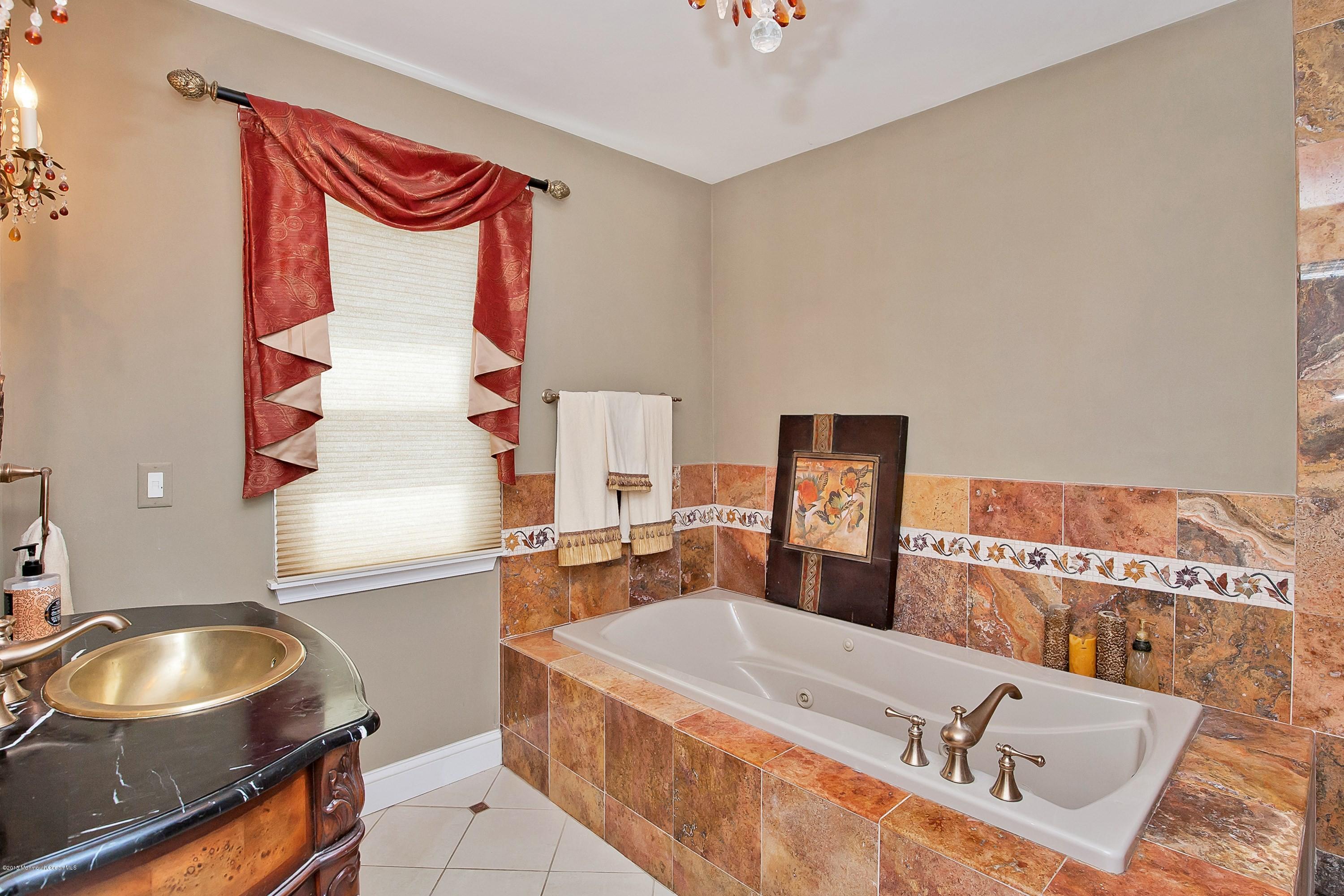 157 Harding Road Red Bank, NJ 07701 - Photo 20 of 37 a bathroom with a sink and a mirror
