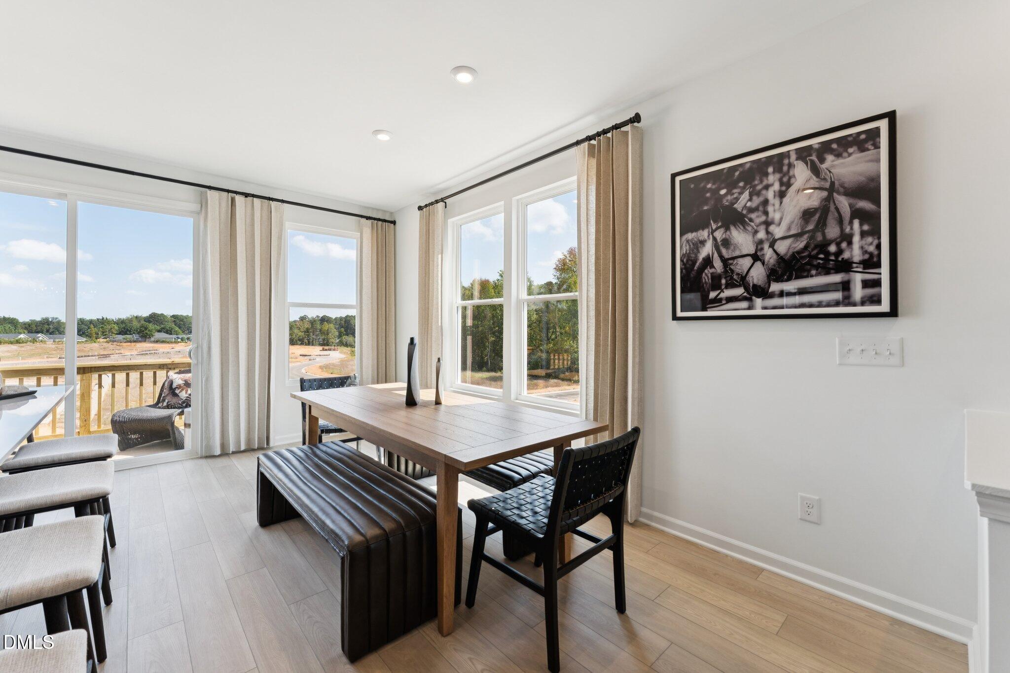 3100 Bomore Road Raleigh, NC 27610 - Photo 10 of 36 a view of a livingroom with furniture and large windows
