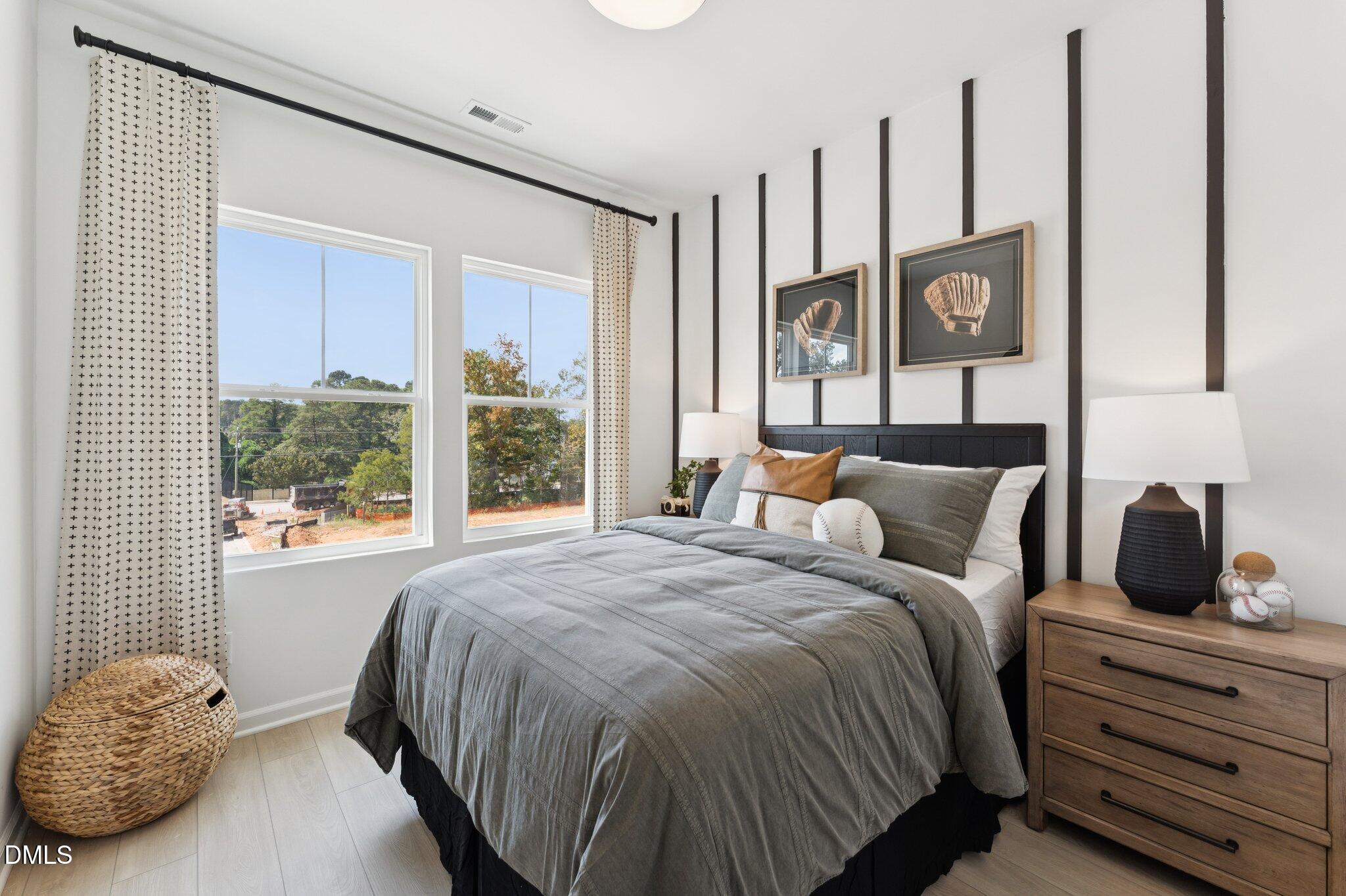 3100 Bomore Road Raleigh, NC 27610 - Photo 20 of 36 a bedroom with a large bed and a window