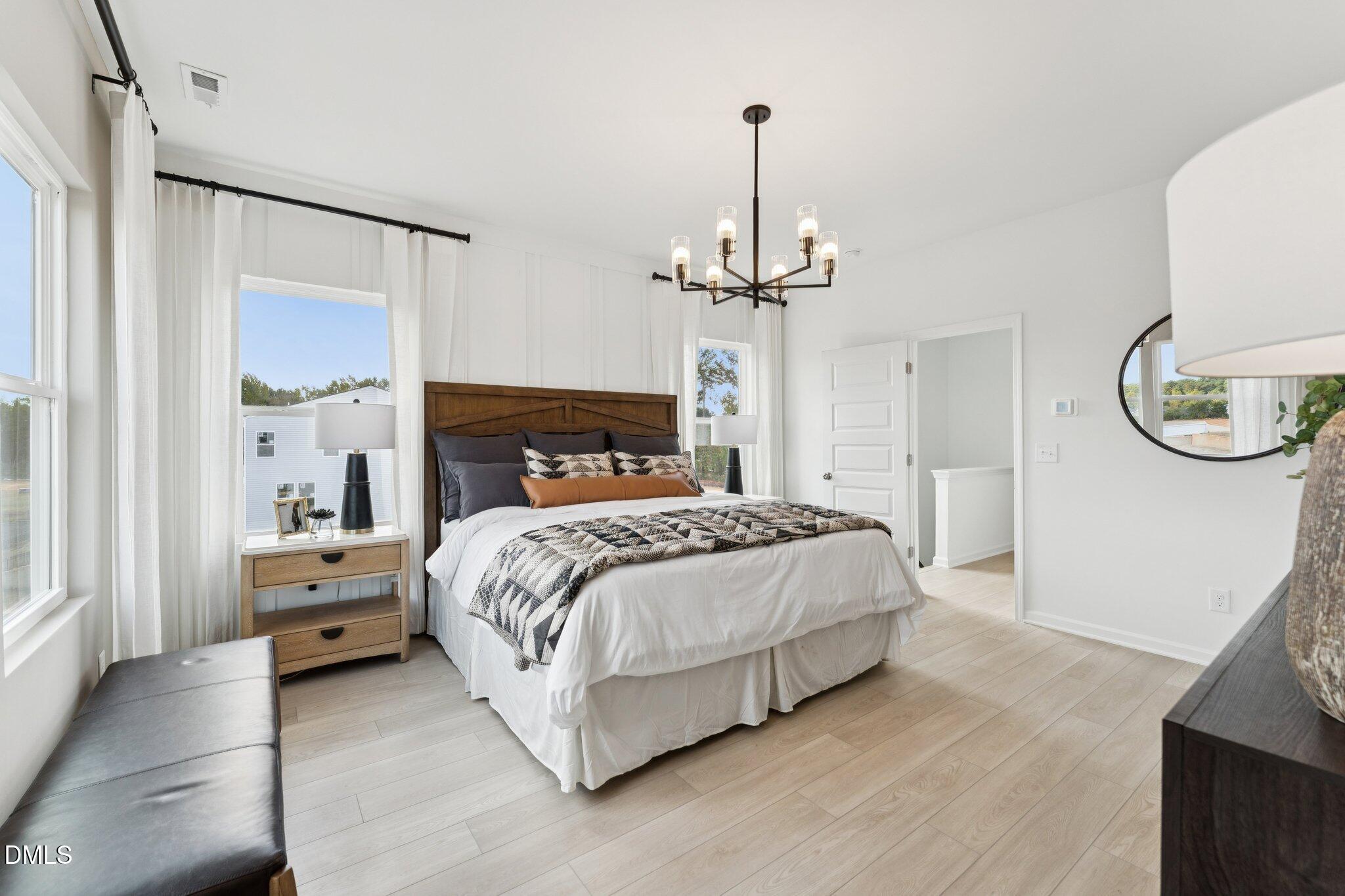 3100 Bomore Road Raleigh, NC 27610 - Photo 23 of 36 a bedroom with a bed and a mirror