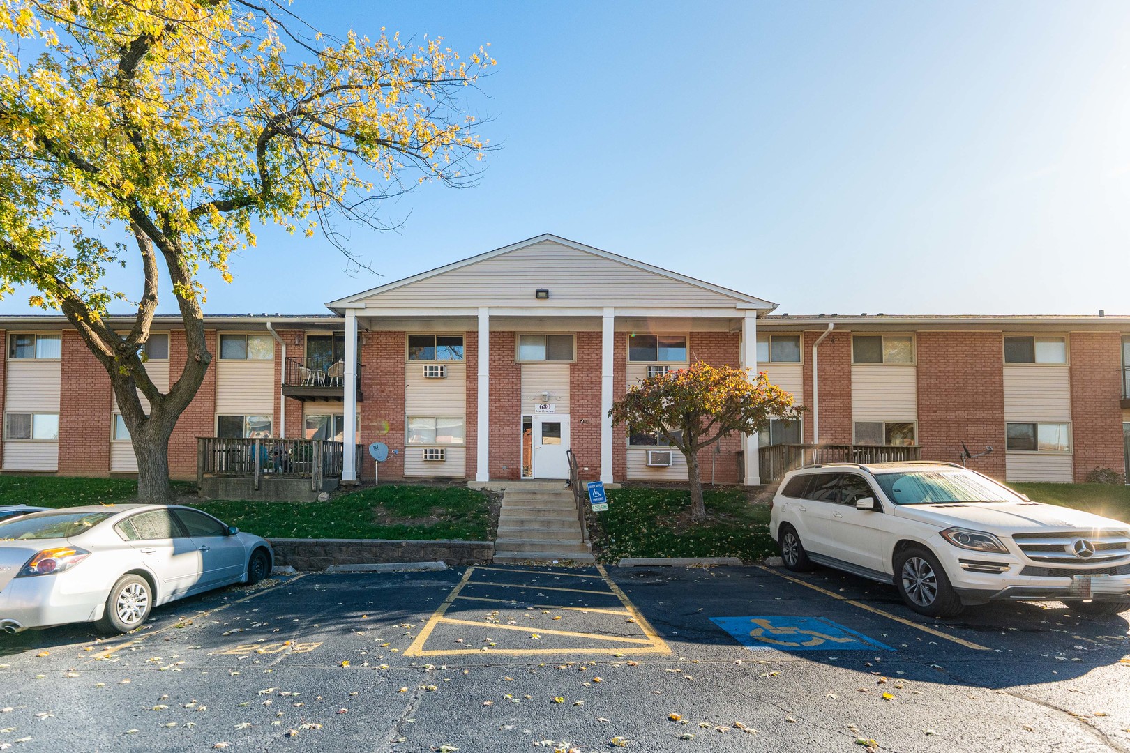 680 Marilyn Avenue, Unit 6206 Glendale Heights, IL 60139 - Photo 1 of 18 a view of a car parked in front of a house