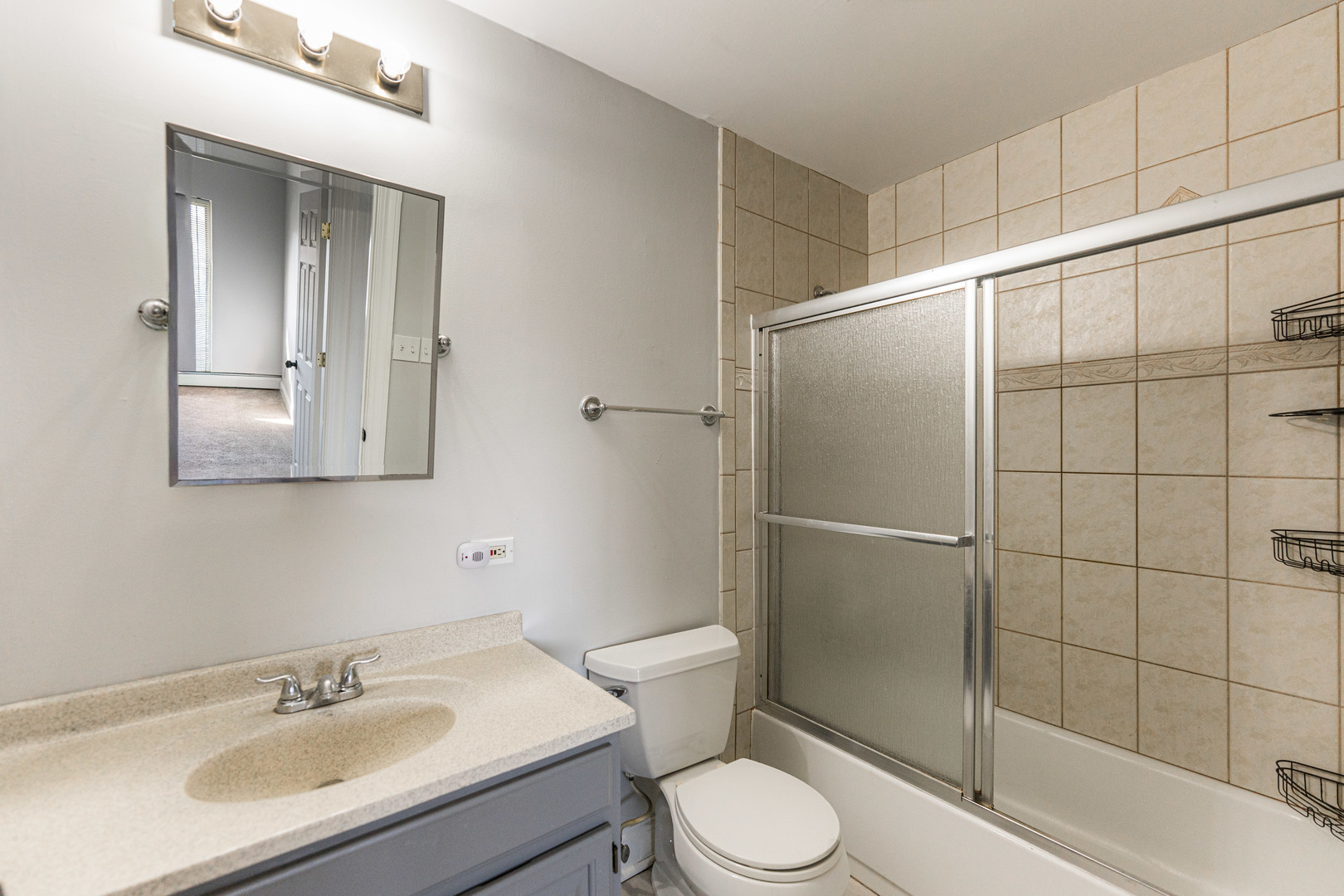 680 Marilyn Avenue, Unit 6206 Glendale Heights, IL 60139 - Photo 16 of 18 a bathroom with a sink toilet and shower