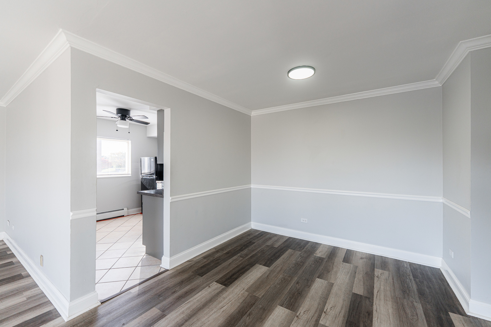 680 Marilyn Avenue, Unit 6206 Glendale Heights, IL 60139 - Photo 7 of 18 wooden floor in an empty room with a window