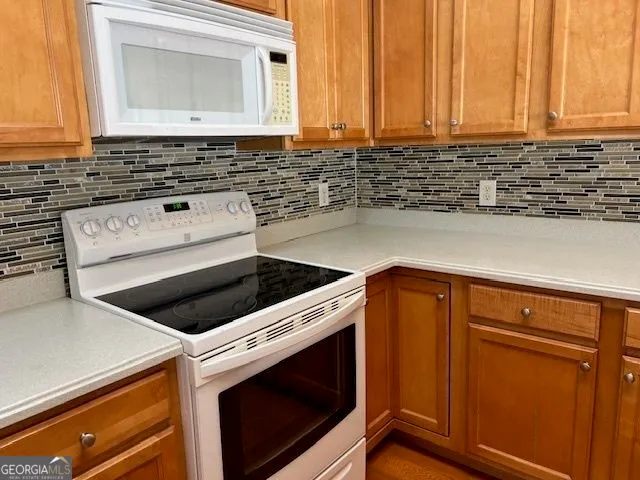 a kitchen with a stove and a sink
