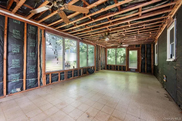 a view of an empty room with a sliding door