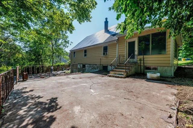 a backyard of a house with wooden floor