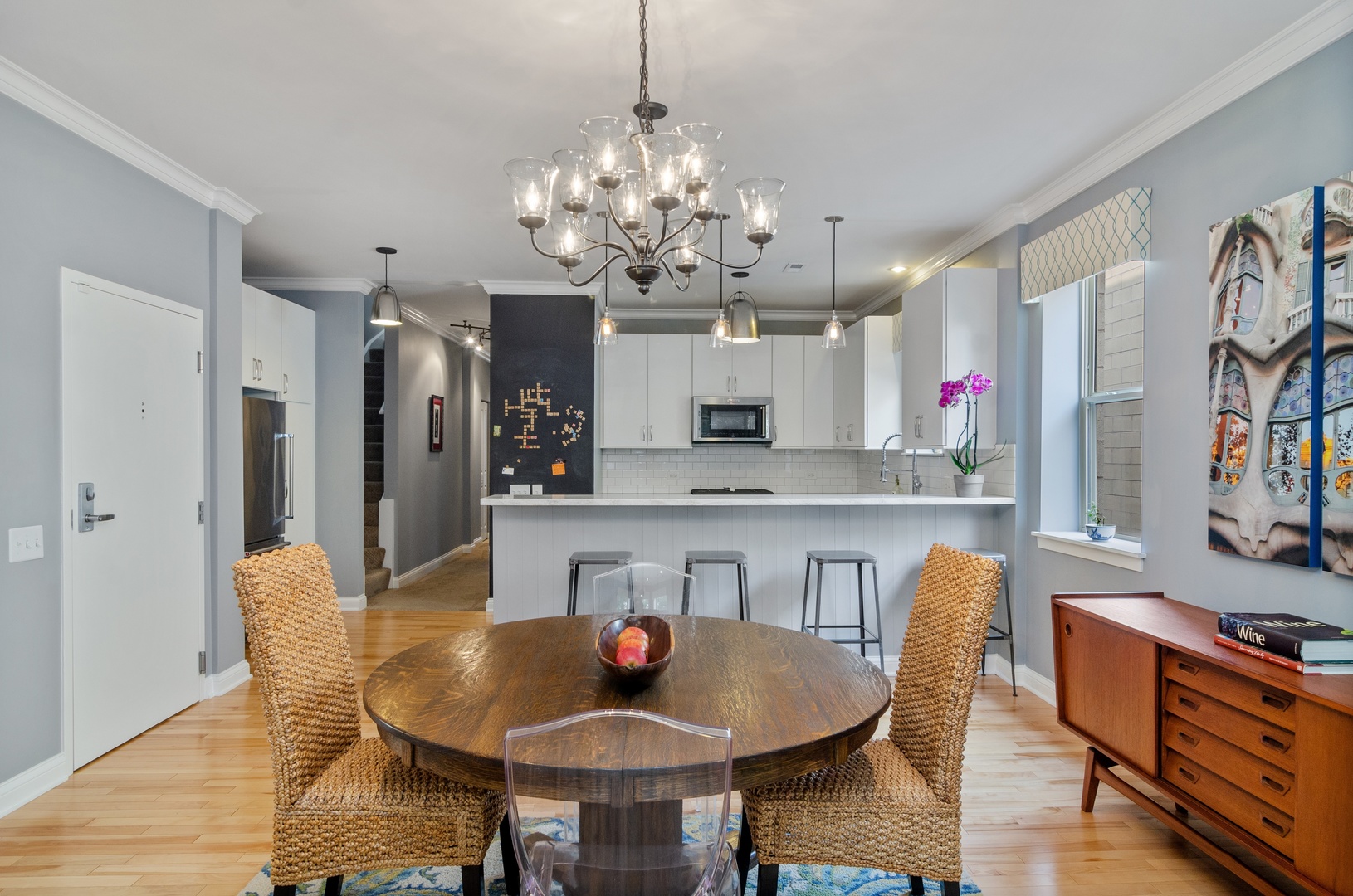 1038 South Racine Avenue, Unit 302 Chicago, IL 60607 - Photo 8 of 19 a view of a dining room with furniture a chandelier and wooden floor