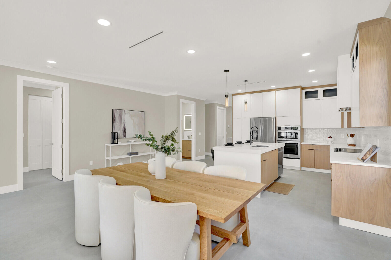 18 Southwest 6th Street Delray Beach, FL 33444 - Photo 12 of 40 a large white kitchen with a table and chairs