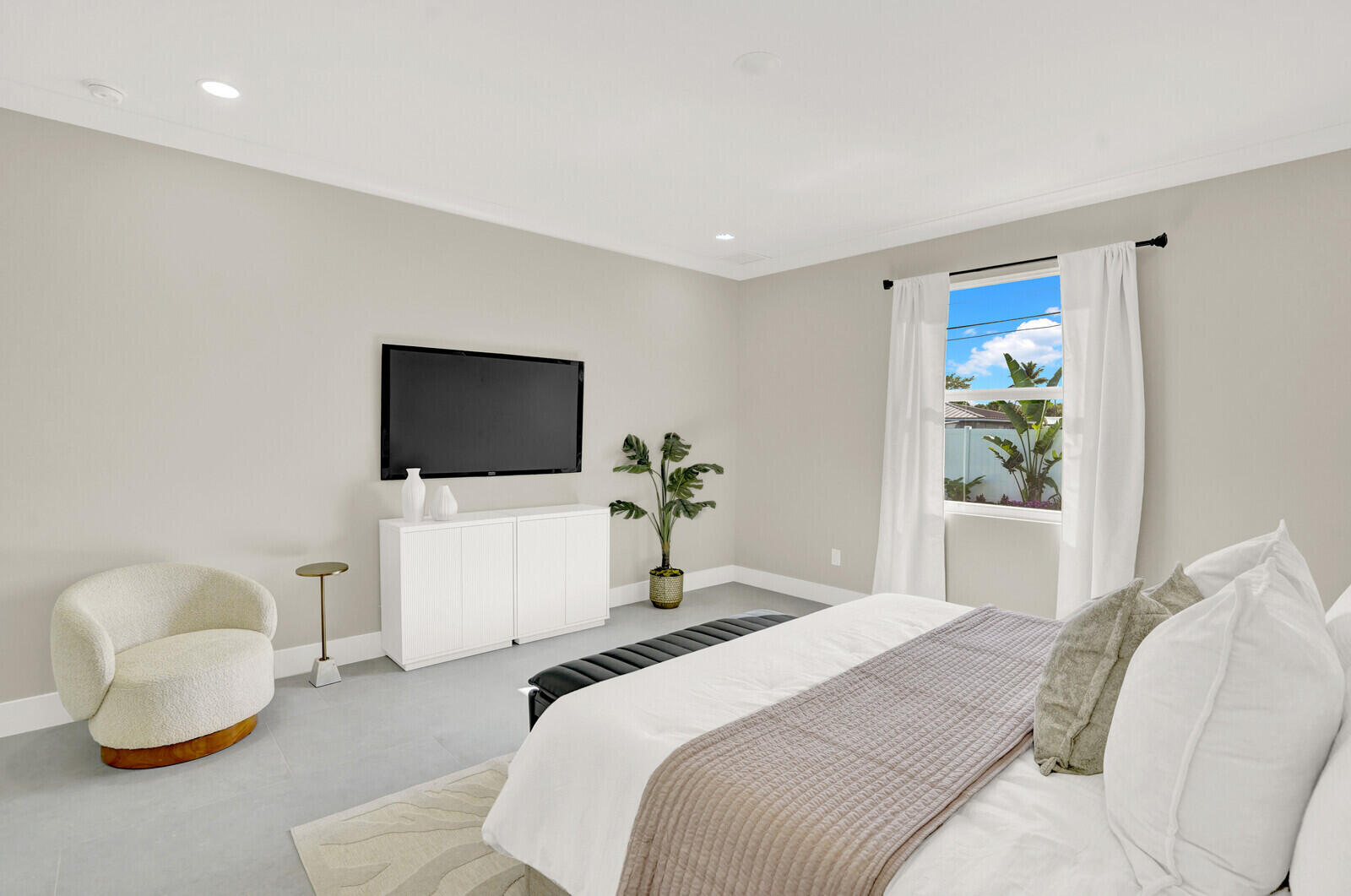 18 Southwest 6th Street Delray Beach, FL 33444 - Photo 18 of 40 a bedroom with a bed and a flat screen tv