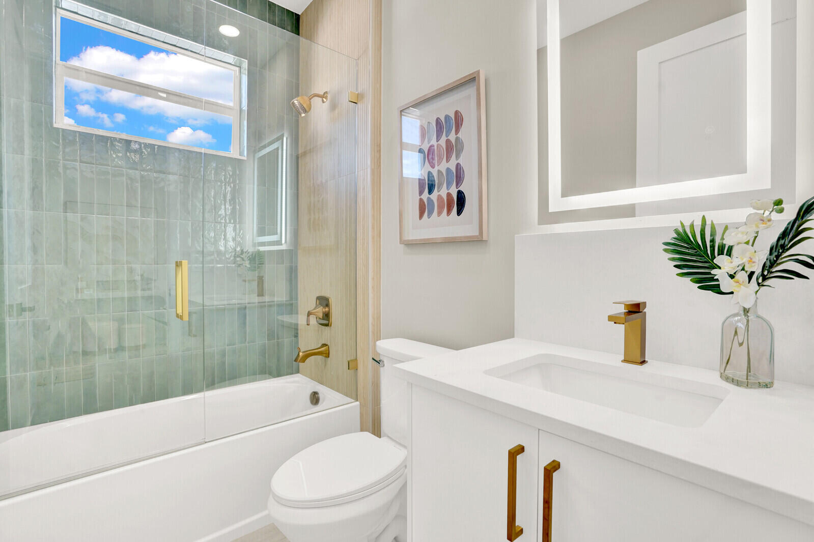 18 Southwest 6th Street Delray Beach, FL 33444 - Photo 22 of 40 a bathroom with a sink a toilet and shower