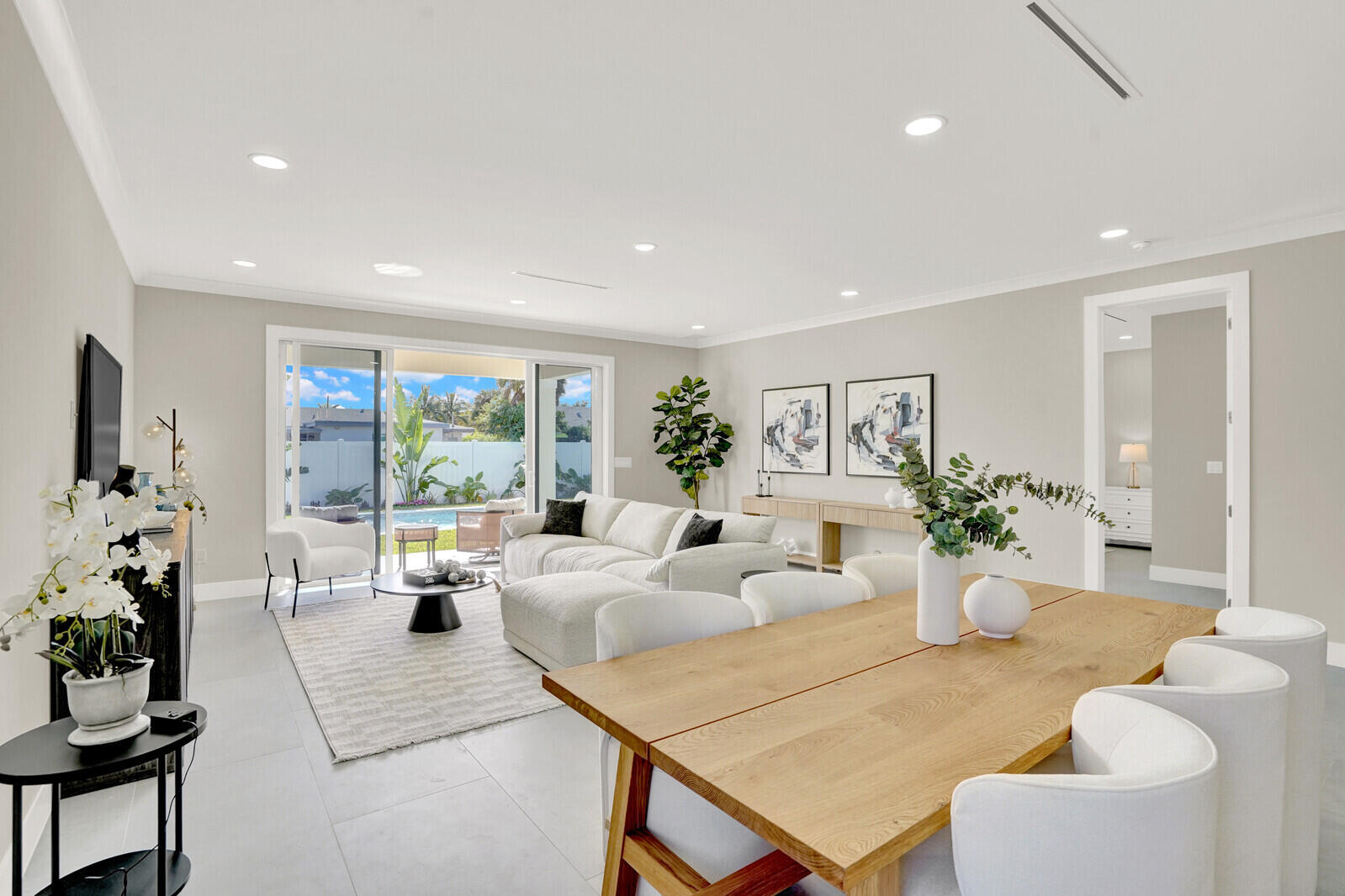 18 Southwest 6th Street Delray Beach, FL 33444 - Photo 10 of 40 a living room with furniture potted plant and a large window