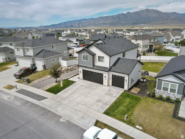 7889 Bristlecone Road Eagle Mountain, UT 84005 - Photo 6 of 42 Contemporary two-story residence featuring a dark shingle roof and light-toned siding