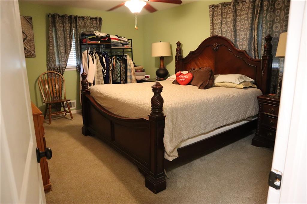2586 Brandon Road Atlanta, GA 30337 - Photo 14 of 24 a bed room with a bed and a closet